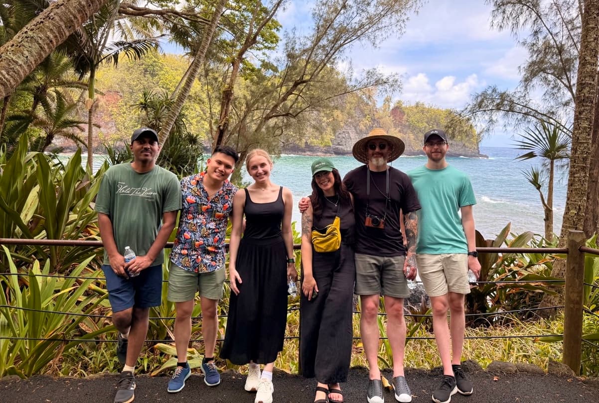 Group of people in front of the ocean
